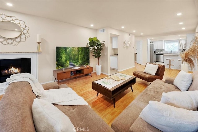 living room with light hardwood / wood-style floors