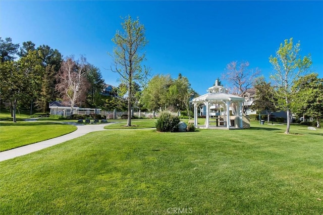 view of community with a gazebo and a lawn