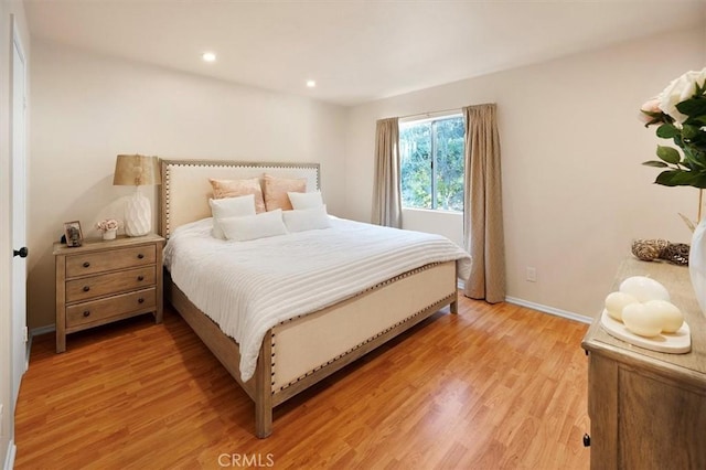 bedroom with hardwood / wood-style floors