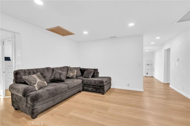 living room with light hardwood / wood-style flooring