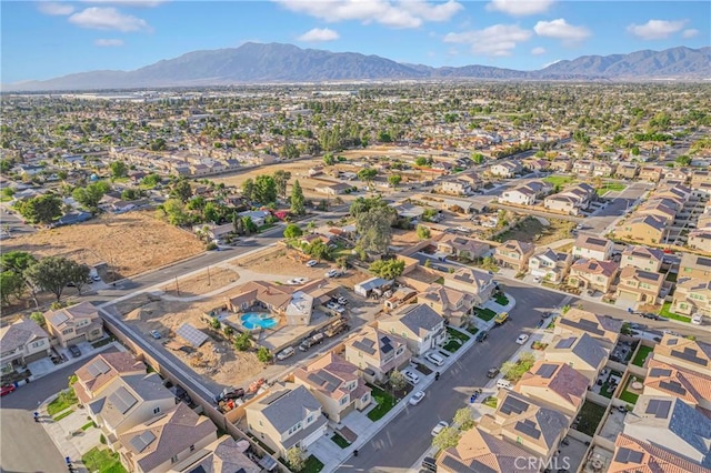 birds eye view of property featuring a mountain view