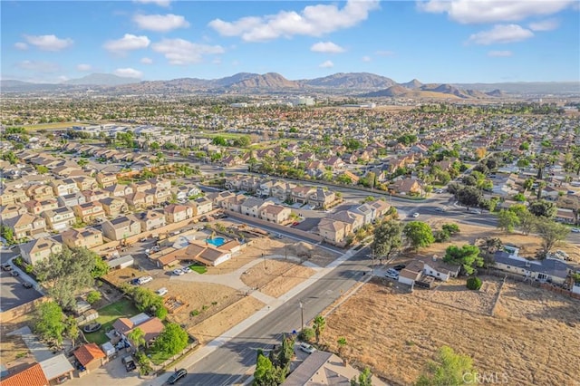 birds eye view of property featuring a mountain view