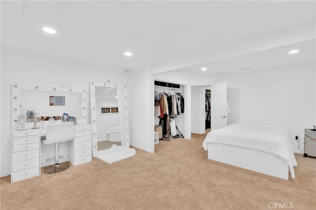 carpeted bedroom with a closet