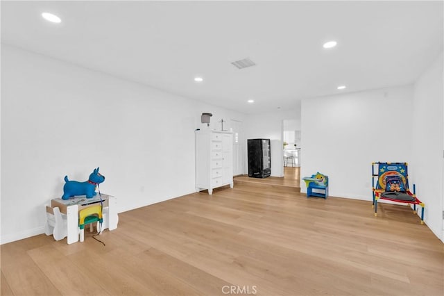 recreation room with light wood-type flooring