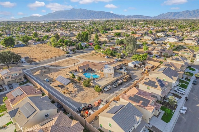 birds eye view of property with a mountain view