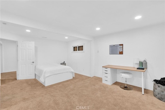 bedroom featuring light colored carpet