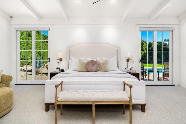 carpeted bedroom featuring beamed ceiling and multiple windows