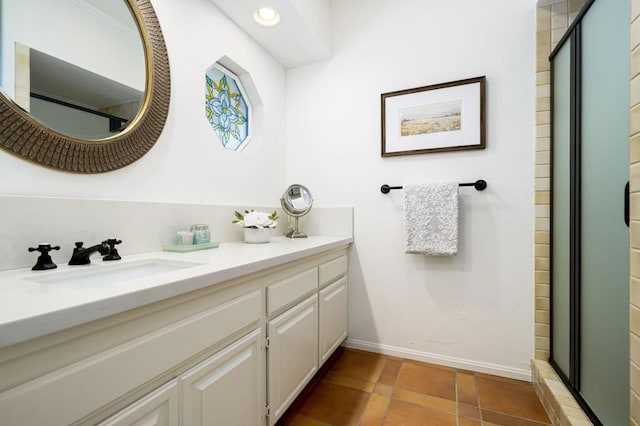 bathroom featuring tile patterned floors, vanity, and walk in shower