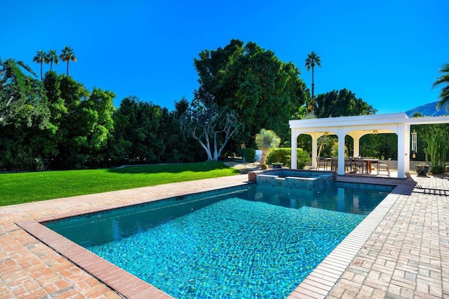 view of swimming pool with a patio area, an in ground hot tub, and a yard