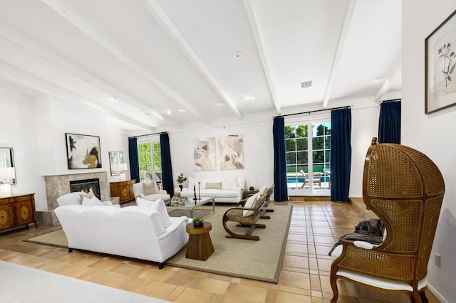 living room with beamed ceiling and light hardwood / wood-style floors