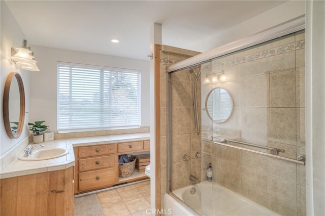 full bathroom with shower / bath combination with glass door, vanity, and toilet