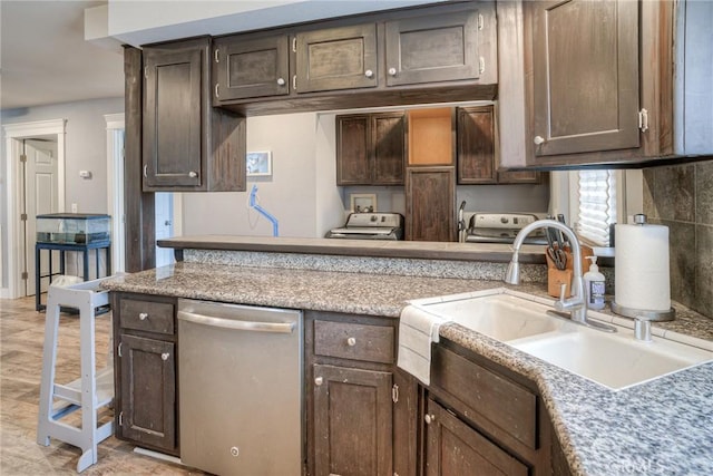 kitchen with dishwasher, dark brown cabinets, and sink