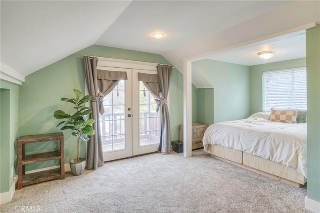 bedroom featuring access to outside, french doors, vaulted ceiling, and carpet