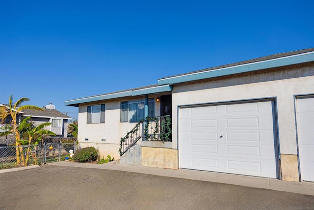 ranch-style house featuring a garage