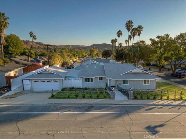 ranch-style house with a mountain view and a garage