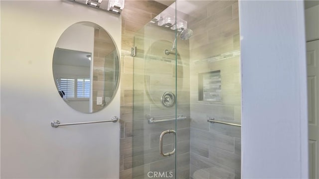 bathroom with a shower with shower door