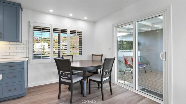 dining room with hardwood / wood-style floors