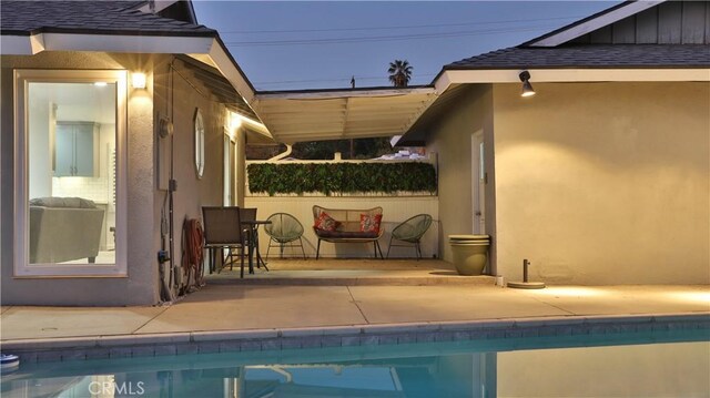 view of swimming pool featuring a patio area