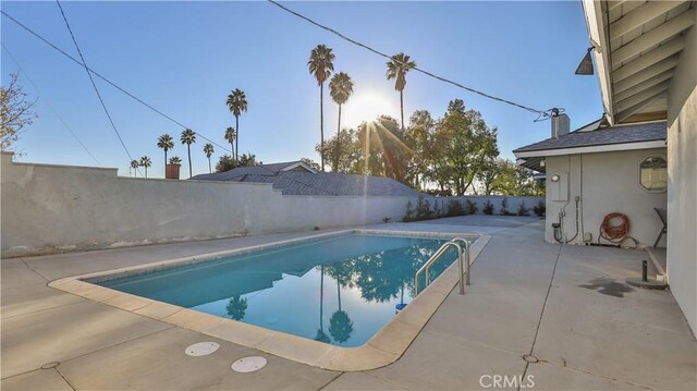 view of swimming pool with a patio