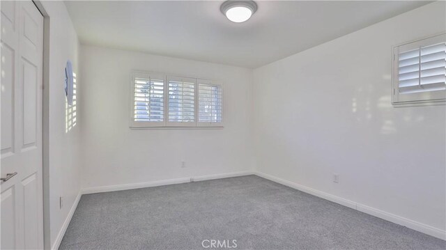 view of carpeted spare room