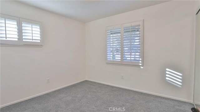 unfurnished room featuring carpet floors