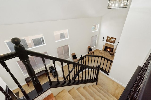 stairs with high vaulted ceiling