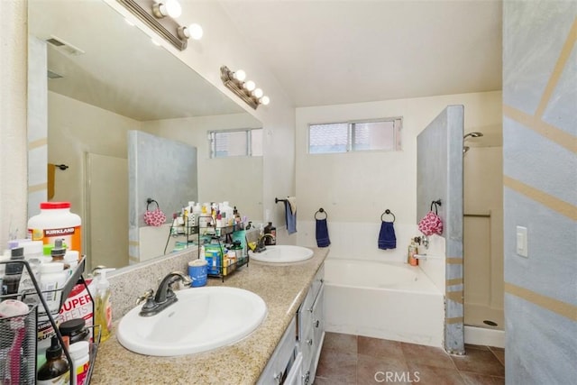 bathroom with shower with separate bathtub, vanity, and tile patterned floors