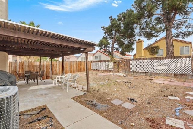 view of yard featuring a pergola, a patio, and cooling unit