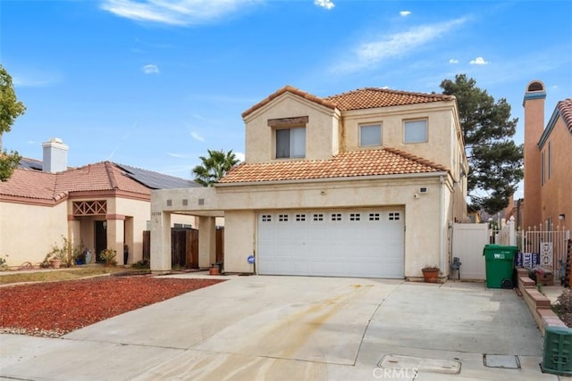 mediterranean / spanish-style home featuring a garage