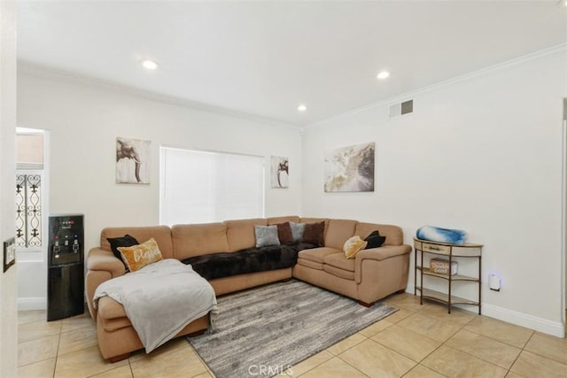 living room with light tile patterned floors and crown molding