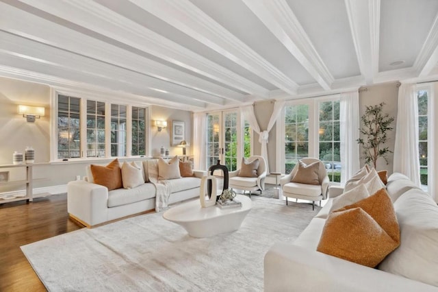 sunroom / solarium featuring beamed ceiling