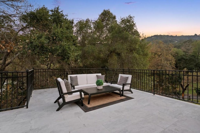 patio terrace at dusk with an outdoor hangout area