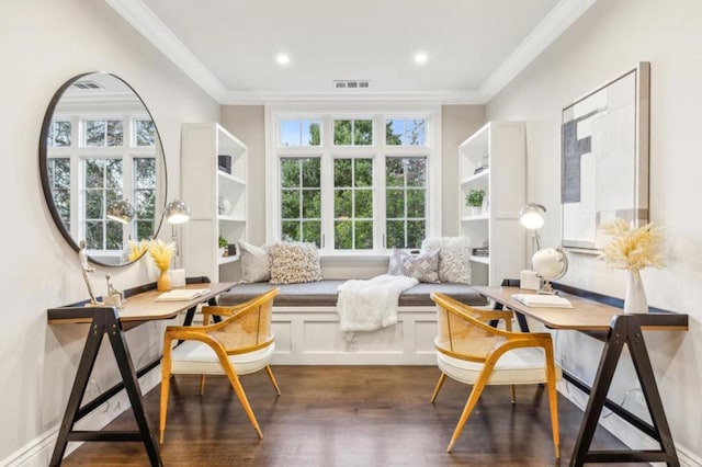 living area with crown molding and dark hardwood / wood-style flooring