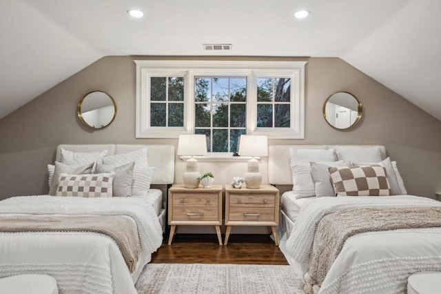 bedroom featuring lofted ceiling and dark hardwood / wood-style floors