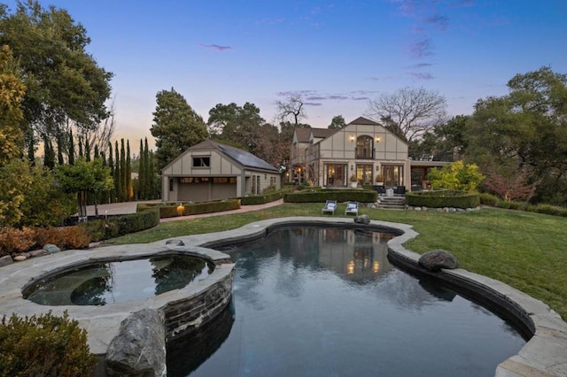 pool at dusk with a lawn