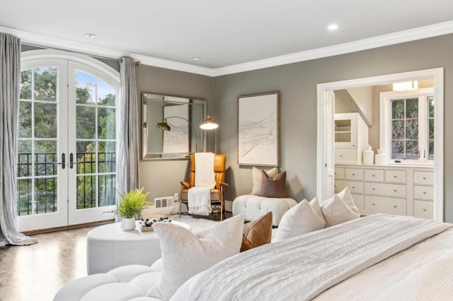 bedroom with connected bathroom, hardwood / wood-style flooring, access to exterior, crown molding, and french doors