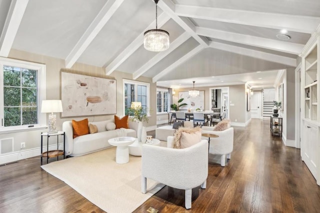 living room with lofted ceiling with beams, dark hardwood / wood-style floors, and a chandelier