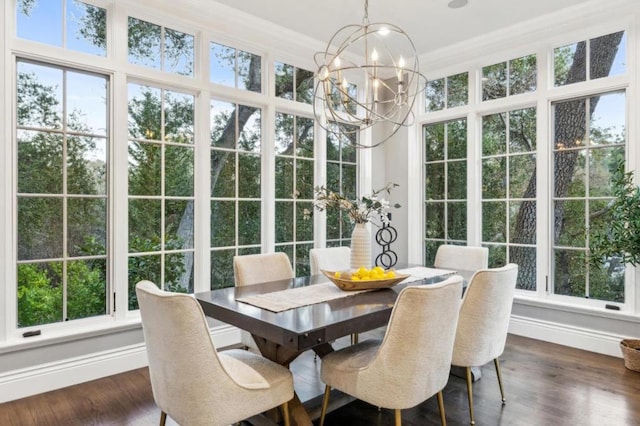 sunroom featuring a chandelier