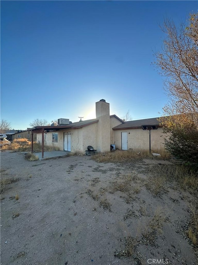 rear view of house with a patio area