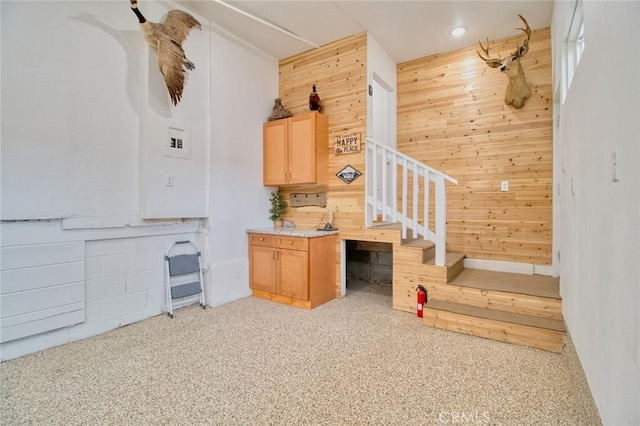 interior space featuring wooden walls