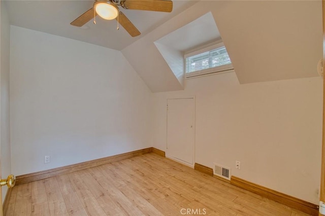 bonus room with ceiling fan, lofted ceiling, and light wood-type flooring