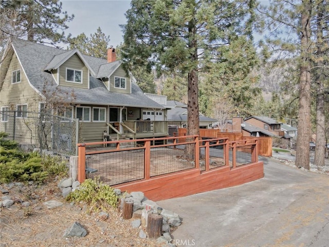 view of front of property with a wooden deck