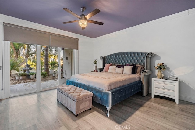 bedroom with access to outside, light hardwood / wood-style floors, ceiling fan, and crown molding