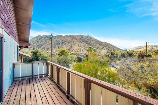 wooden terrace featuring a mountain view