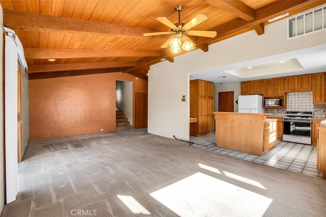 kitchen featuring ceiling fan, white appliances, light carpet, and tasteful backsplash