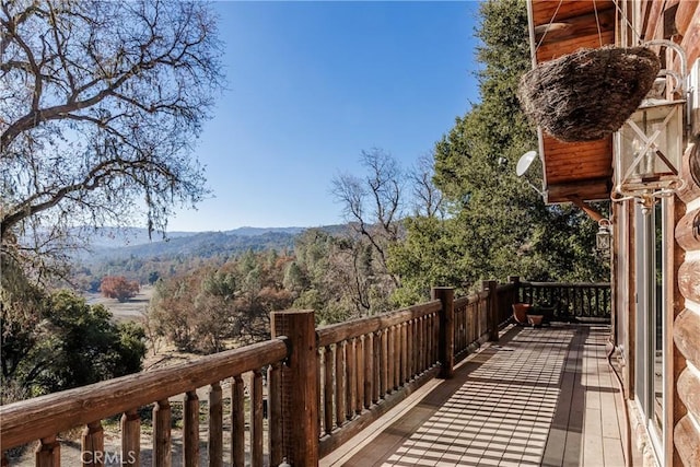 wooden deck with a mountain view