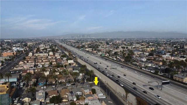 birds eye view of property featuring a mountain view