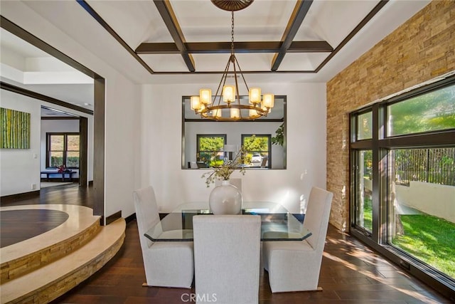 dining room with beamed ceiling, a healthy amount of sunlight, and coffered ceiling