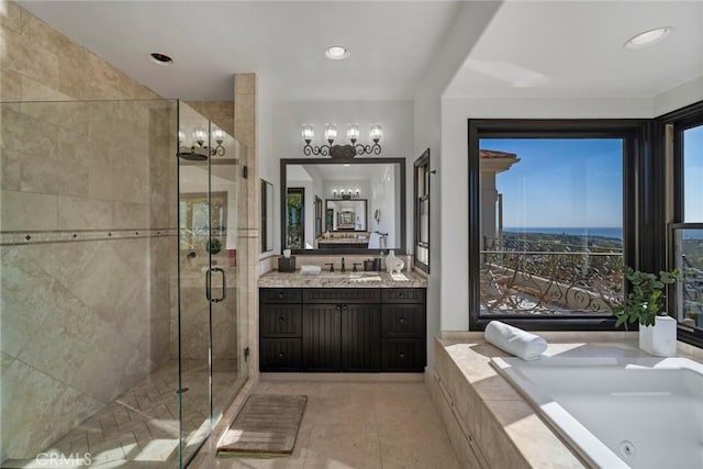 bathroom with plus walk in shower, vanity, and tile patterned floors