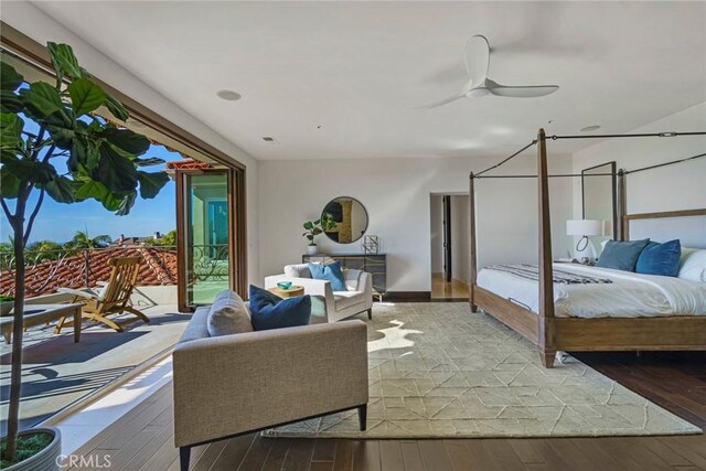 bedroom with access to exterior, ceiling fan, and hardwood / wood-style floors